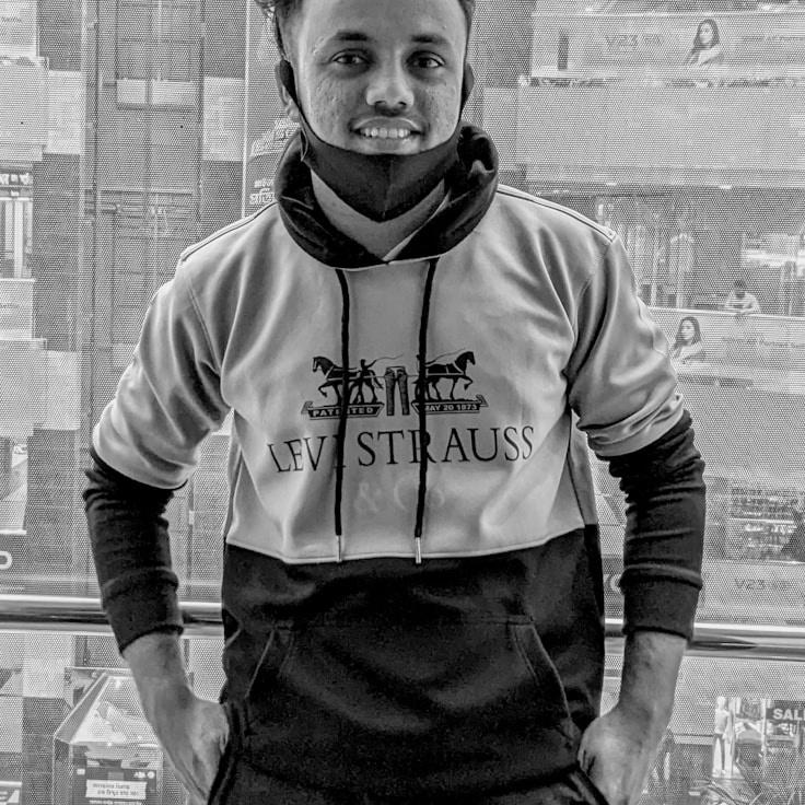 Aria Chen, Lead Design Curator at WaveGardenPath, reviewing corporate floral arrangements